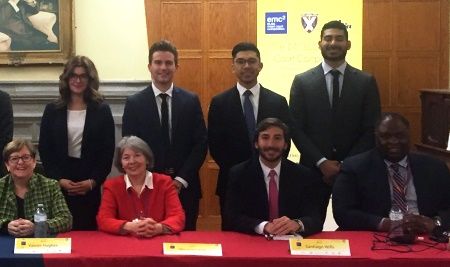 Queen’s ELSA mooters (standing, l-r:) Devon Luca, Cameron Rempel, Brandon Chung and Gurpaul Sandhu, with four judges at the competition.