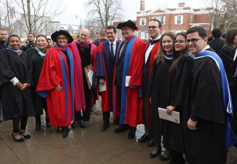 Dean Mark Walters, Law’89 (5th left), poses with faculty, staff and some new law grads outside Grant Hall on November 14. 