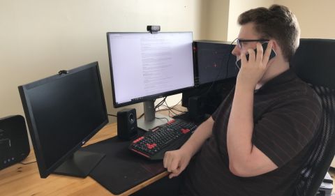 QLA Outreach Co-ordinator Eli White, Law’21, listens attentively to a new client on his phone at home, so he can gauge the scale of the client’s legal problem and the emotional impact it is having upon the individual. 