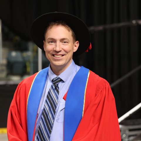 Ryan Minor, PhD’24, who received his doctoral degree from Queen’s on June 21, reflects on his time at Queen’s Law and explores arguments for and against Canada implementing a preferential tax treatment for intellectual property income that could spark a surge of innovation and productivity. (Photo by Bernard Clark)