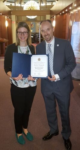 Kaisha Thompson, Law’16, accepts the Mayor Andrée Boucher Memorial Scholarship from Mayor Bryan Paterson at Kingston City Hall on Jan. 27.