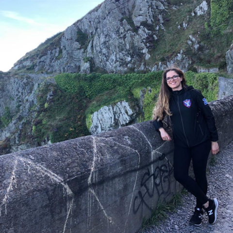 Student in front of cliffs in Ireland