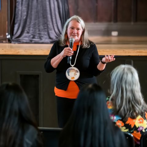 Federally appointed Independent Special Interlocutor Kimberly Murray presents “Sites of Truth, Sites of Conscience,” her July 2024 report on unmarked burials and mass graves of missing and disappeared Indigenous children in Canada, to Queen’s University community members in Grant Hall on Sept. 26. 