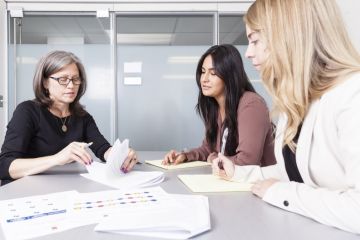 Karla McGrath, LLM’13, Queen’s Family Law Clinic Director, reviews a case file with student caseworkers in one of four interview rooms in the downtown Queen’s Law Clinics. “We have a modern and efficient professional legal operation that clearly expresses to clients and students that we are here to do important work and we are here to do it well,” she says. 