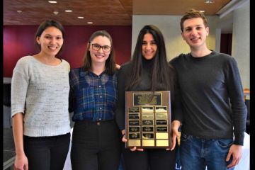 Accepting the 2019 Law Students’ Society Camaraderie Award are Queen’s Venture Law Society executive members Emma Wall, Heather Bonnell, Nataly Dil and Marc Vani. 